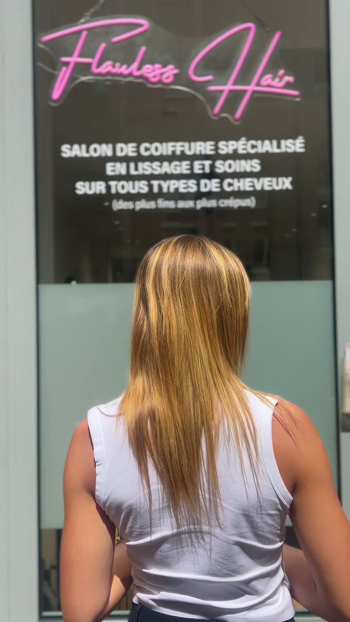 Client outside the salon front, long wavy blonde hair